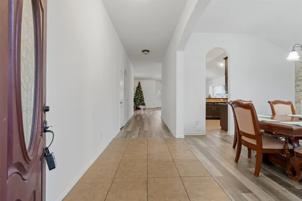 a view of a hallway with seating area