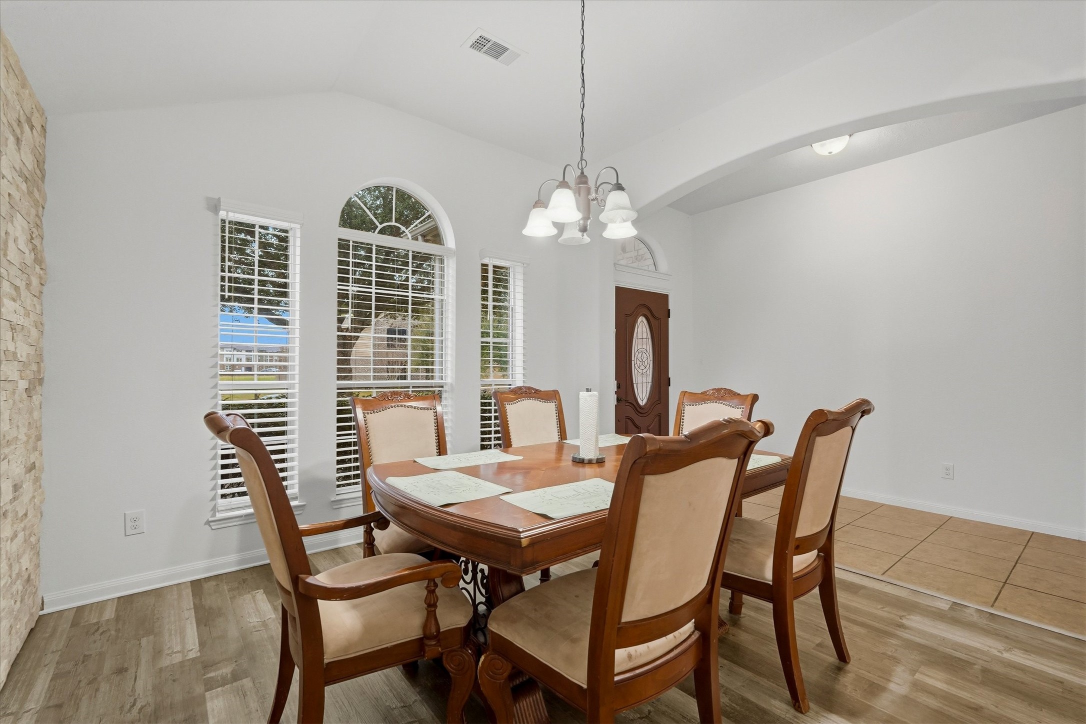 16518 Dover Mills Drive Spring, TX 77379 - Photo 6 of 28 a view of a dining room with furniture wooden floor and chandelier
