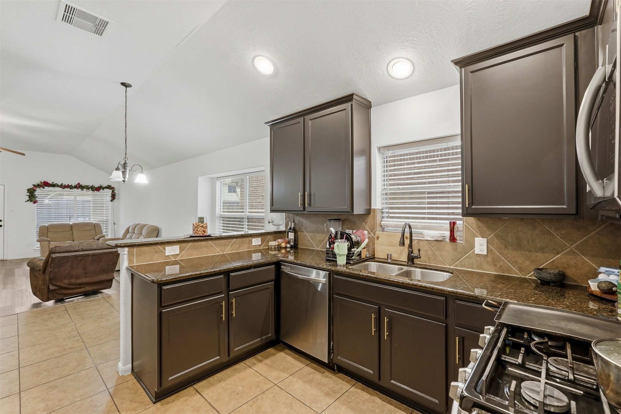16518 Dover Mills Drive Spring, TX 77379 - Photo 10 of 28 a kitchen with a sink stove and refrigerator