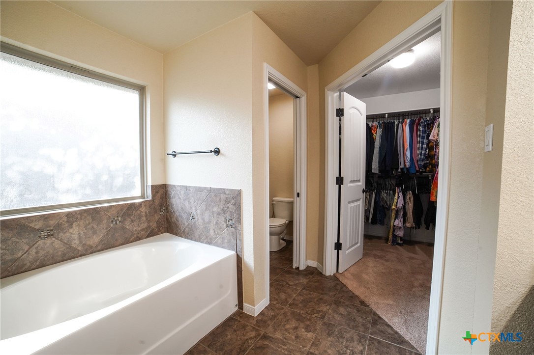 3422 Doss Street Copperas Cove, TX 76522 - Photo 17 of 29 a bathroom with a bathtub and a shower