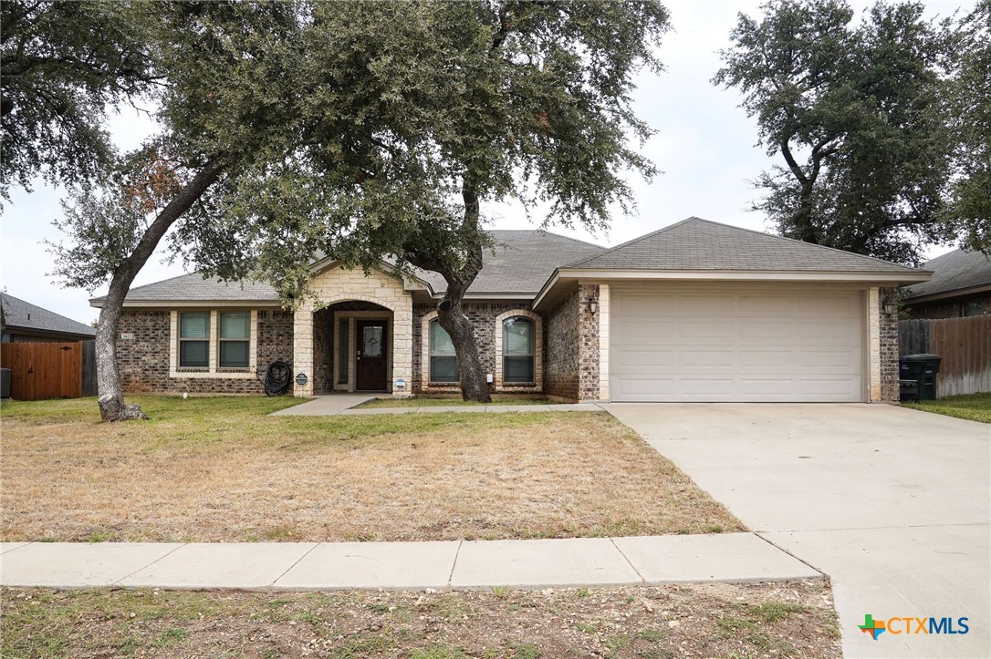 3422 Doss Street Copperas Cove, TX 76522 - Photo 2 of 29 a front view of a house with garden