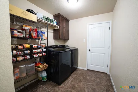 a room with wooden cabinets and a table