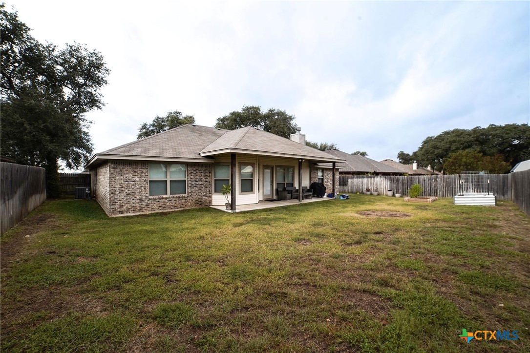 3422 Doss Street Copperas Cove, TX 76522 - Photo 28 of 29 a front view of a house with a garden