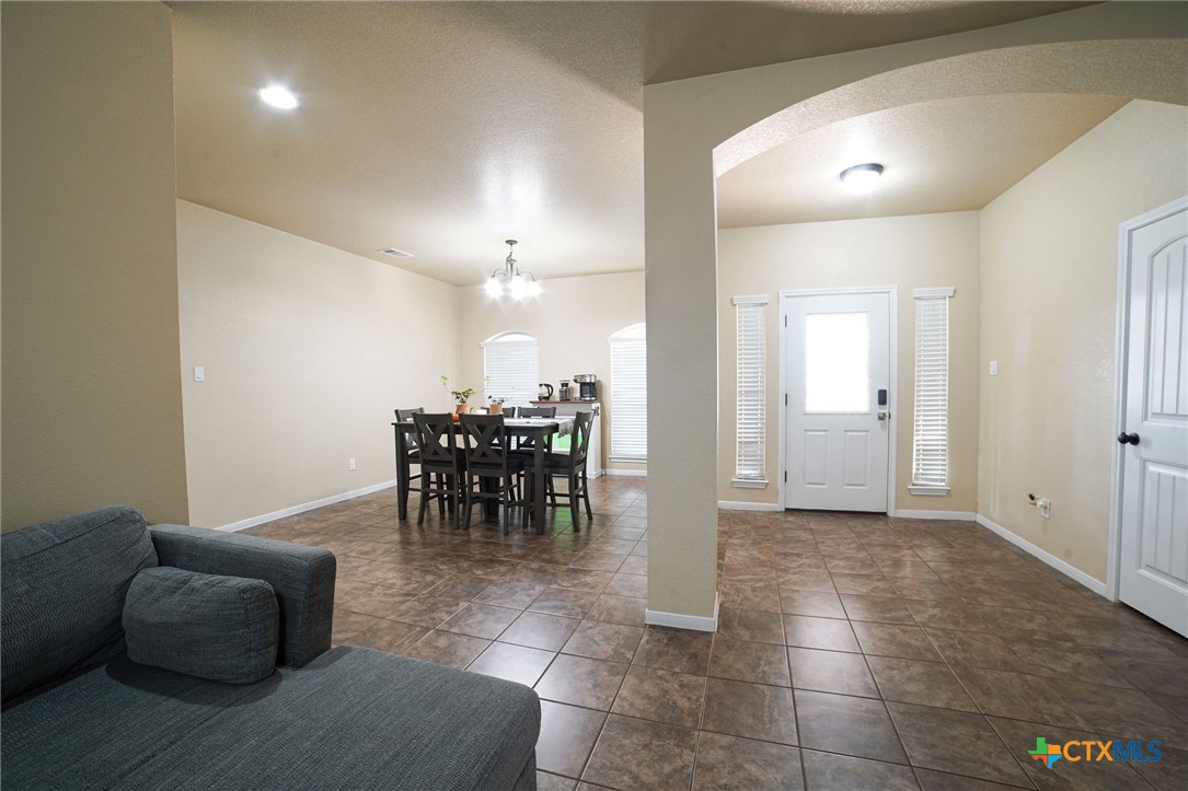 3422 Doss Street Copperas Cove, TX 76522 - Photo 6 of 29 a view of a livingroom with furniture and a chandelier