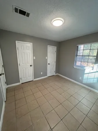 a view of a livingroom with a dishwasher and a window