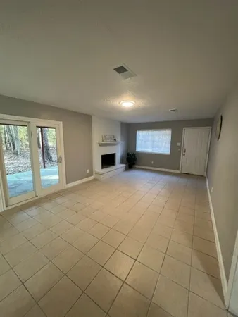 a view of an empty room and a window