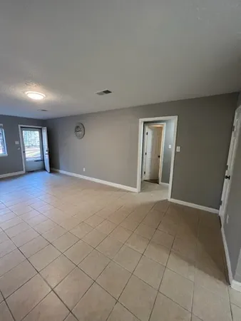 a view of an empty room and window
