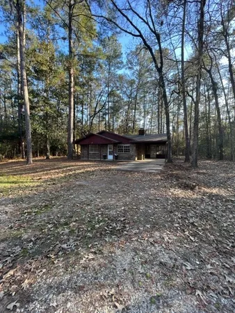 a view of outdoor space with deck and trees