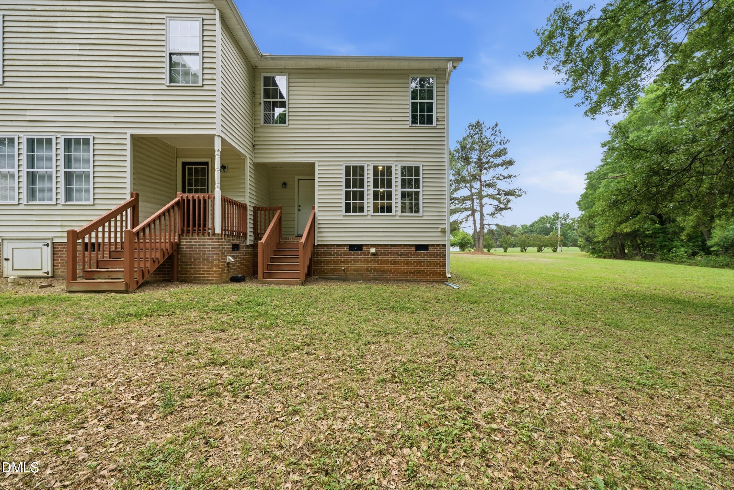201 Tonylee Court, Unit A Raleigh, NC 27603 - Photo 4 of 30 a view of a house with backyard and garden