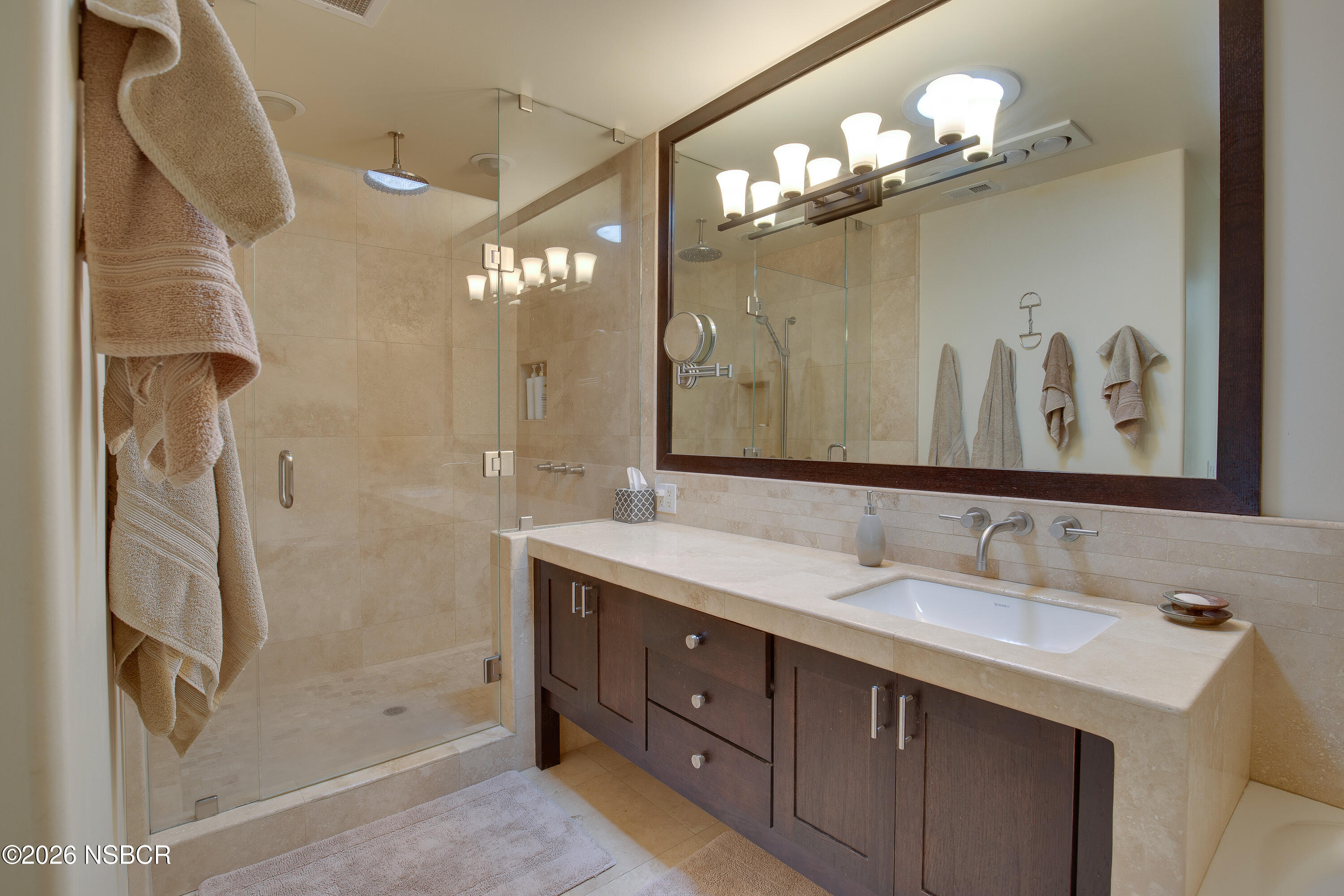850 Fredensborg Canyon Road Solvang, CA 93463 - Photo 14 of 26 a bathroom with a double vanity sink mirror and shower