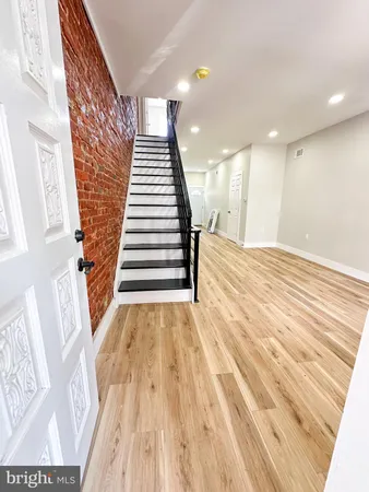 a view of entryway with wooden floor