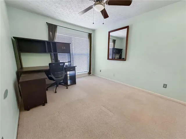 a workspace with a desk and chair