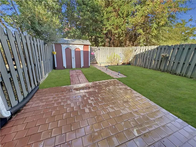 a view of backyard with green space