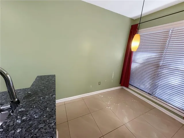 a view of a room with window and door