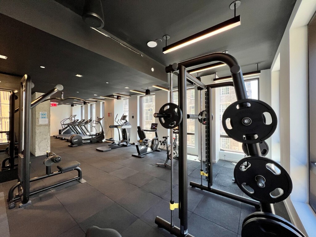 242 Broome Street, Unit 7D Manhattan, NY 10002 - Photo 16 of 22 a view of a room with gym equipment