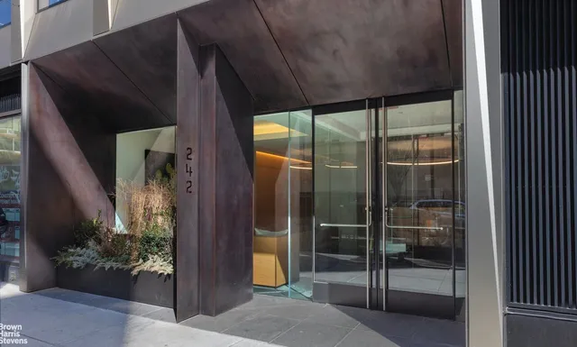 a room with gym equipment and large mirror