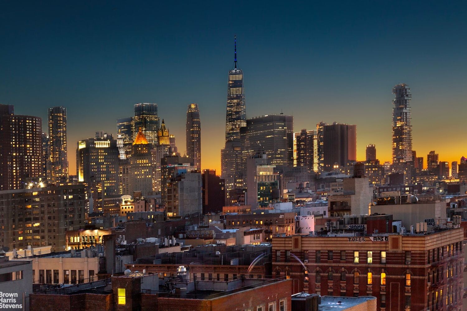 242 Broome Street, Unit 7D Manhattan, NY 10002 - Photo 20 of 22 a city street filled with lots of tall trees