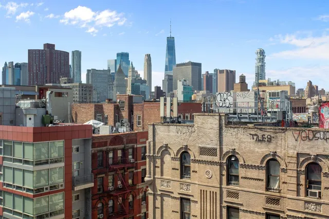 a city street filled with lots of tall trees