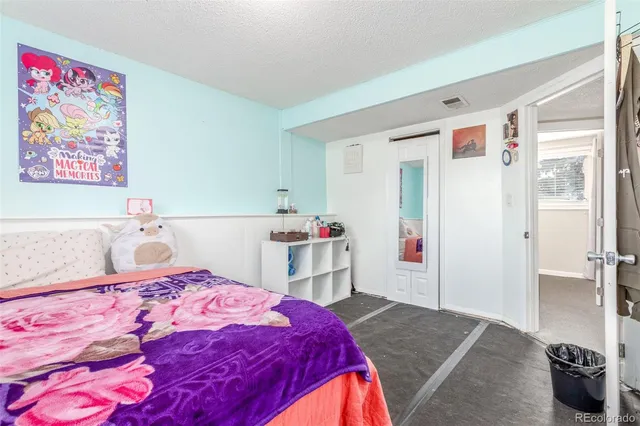 a bedroom with a bed and a cabinets