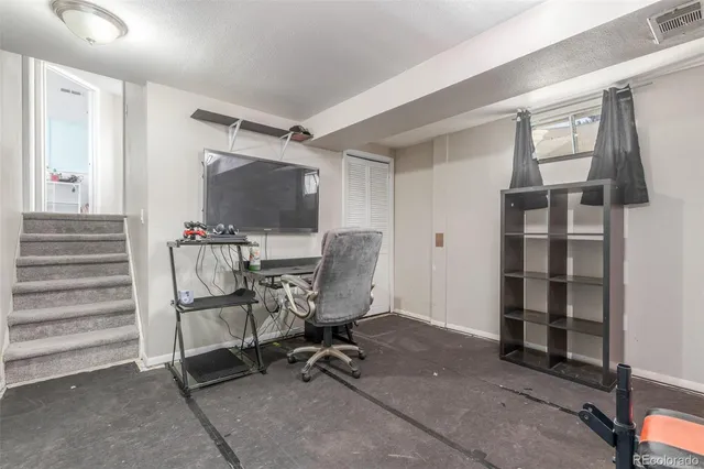 a view of a workspace with furniture