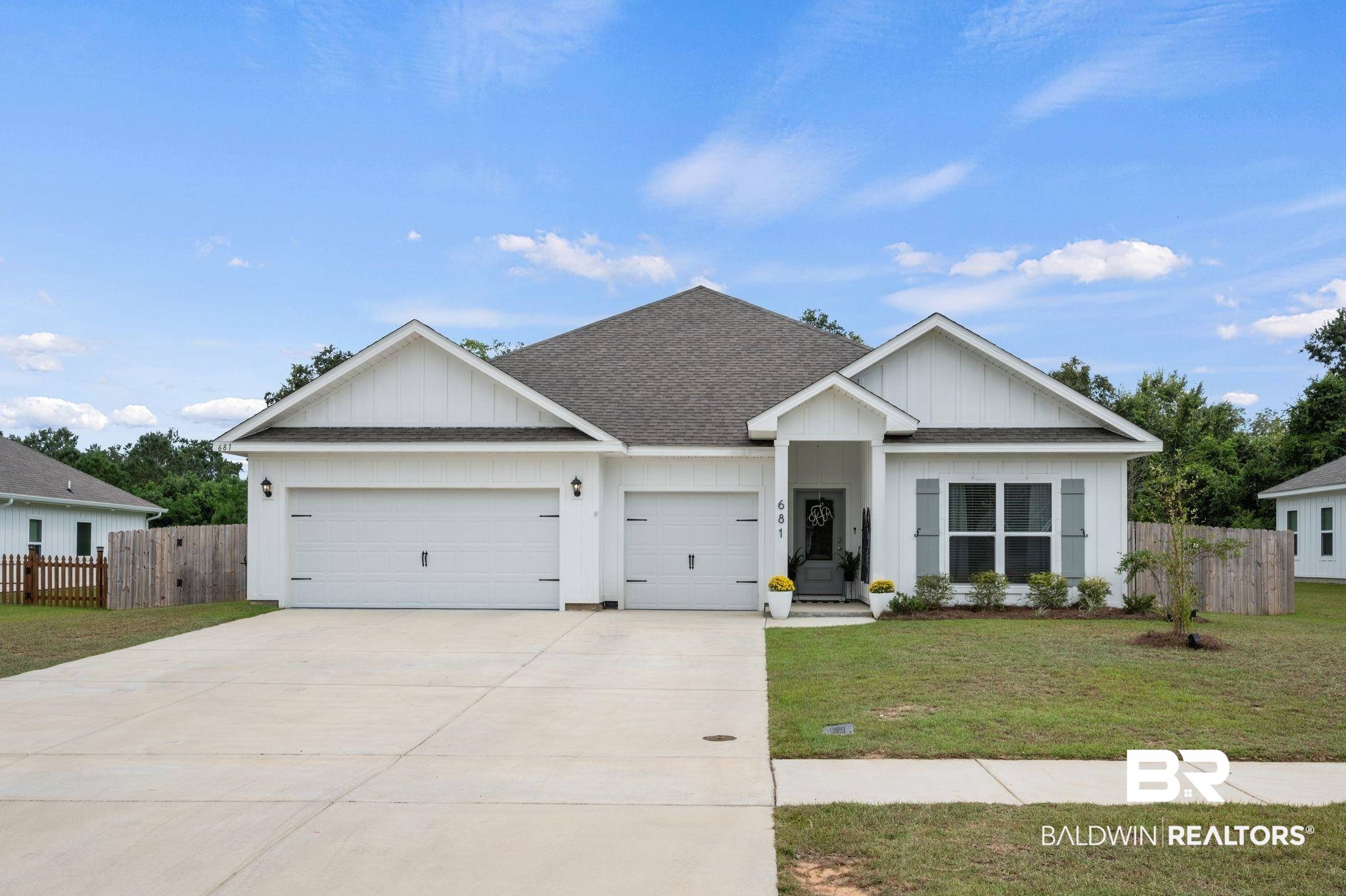 681 Calibre Street Fairhope, AL 36532 - Photo 1 of 56 View of front of property featuring a garage and a front lawn
