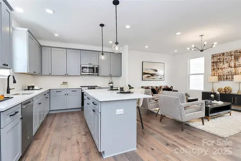 a kitchen with a sink cabinets and window