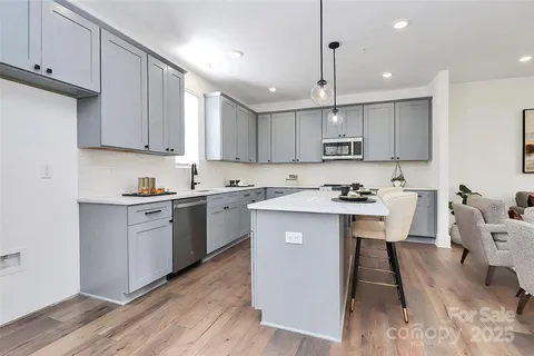 a kitchen with a table and chairs in it