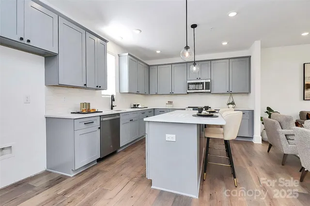a kitchen with a table and chairs in it