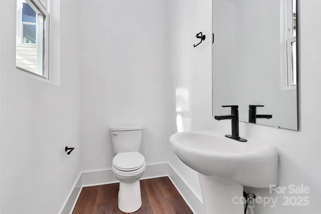 a view of entryway with wooden floor and stairs