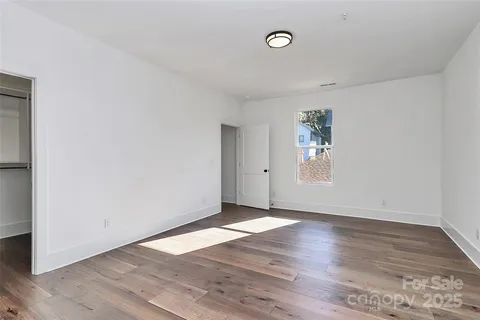 a view of an empty walk in closet