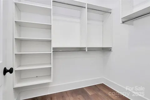 a bathroom with a double vanity sink mirror and shower