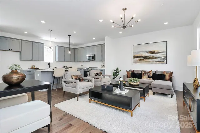 a living room with furniture and chairs