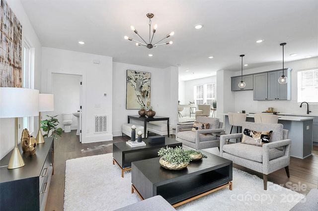 a living room with furniture and a table
