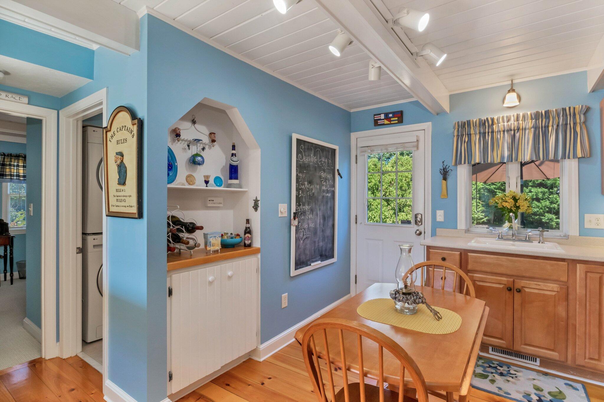 153 Jericho Path, Unit 8U Falmouth, MA 02540 - Photo 13 of 52 a view of a dining room with furniture window and wooden floor
