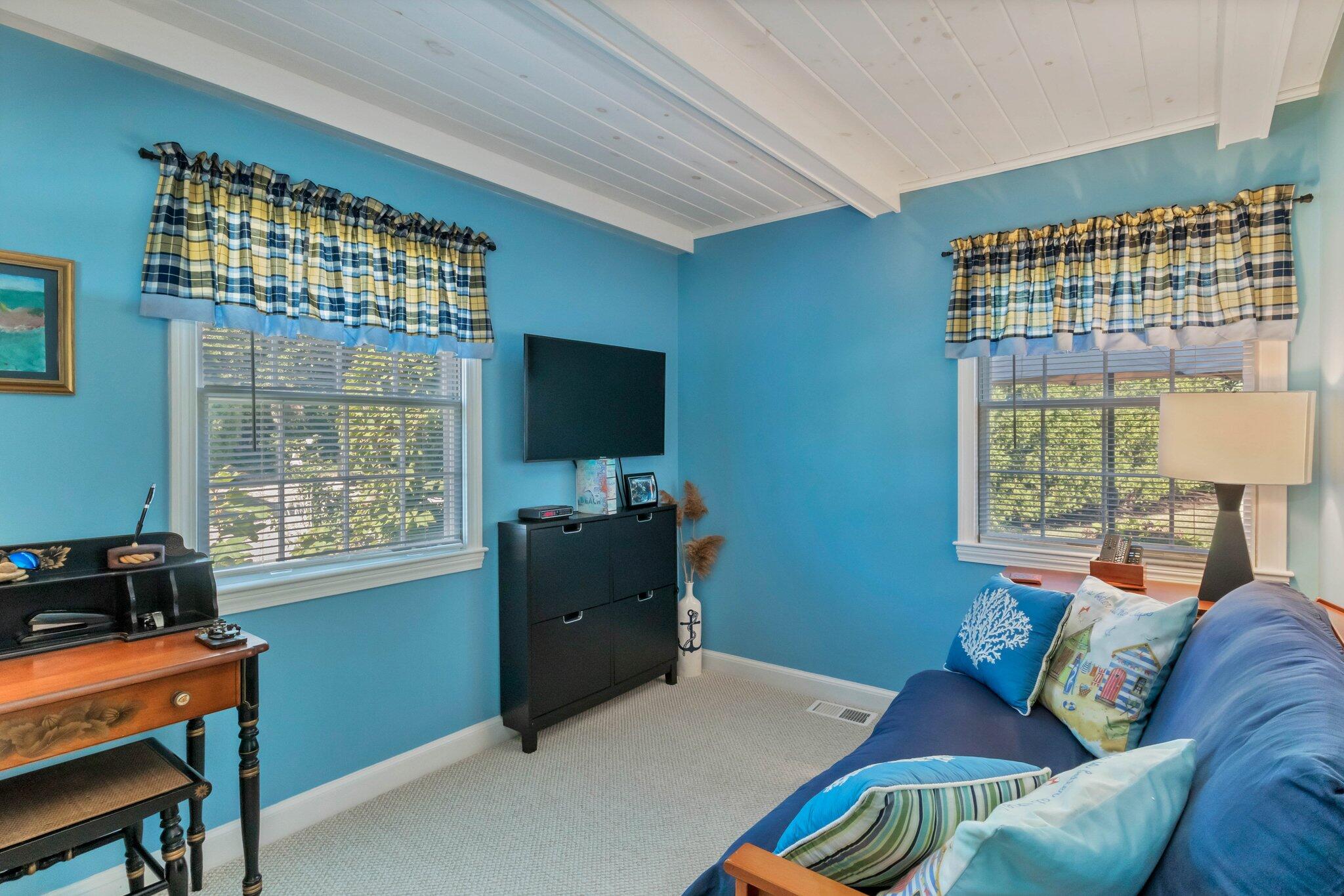153 Jericho Path, Unit 8U Falmouth, MA 02540 - Photo 17 of 52 a living room with furniture and a flat screen tv