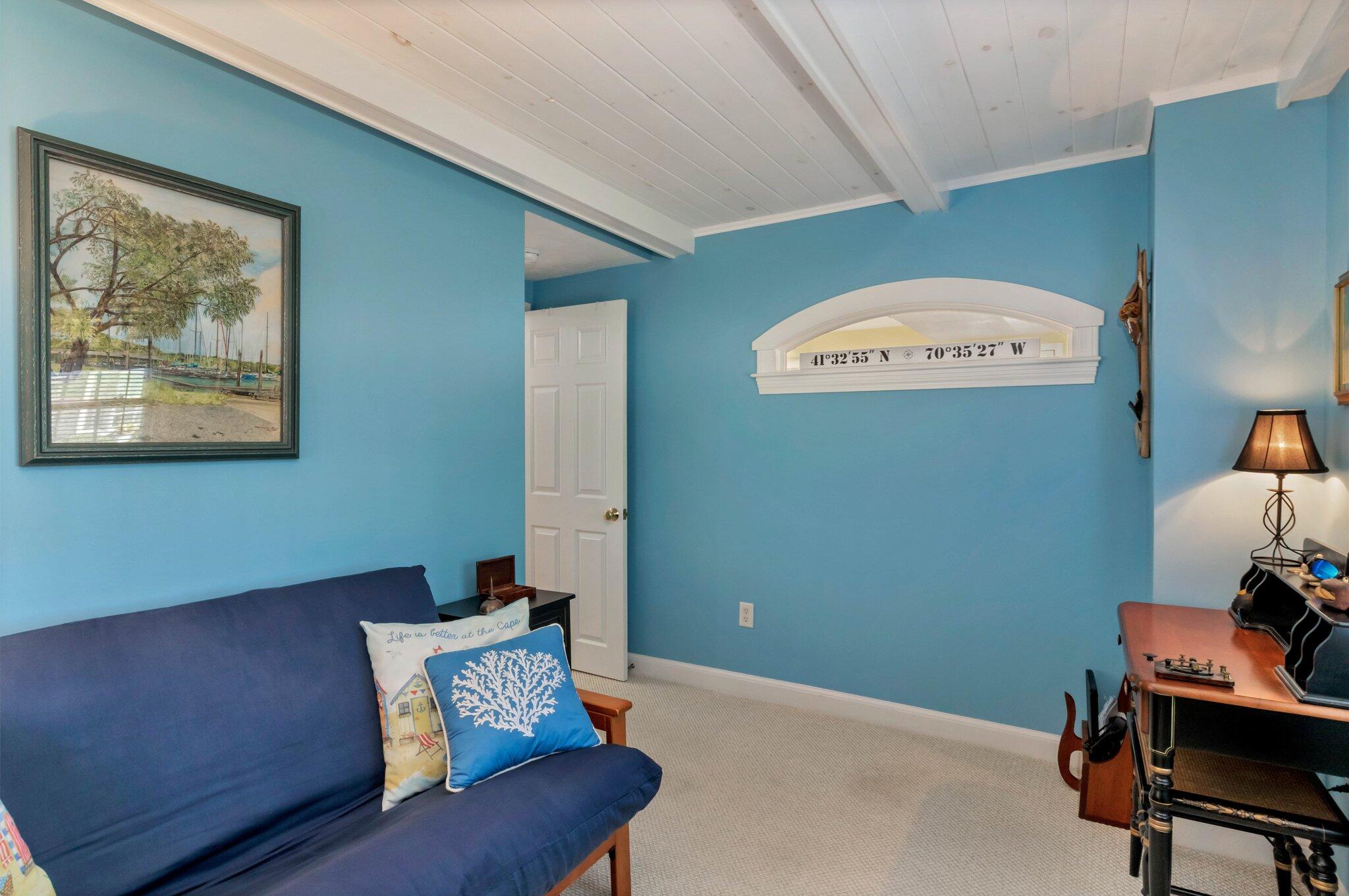 153 Jericho Path, Unit 8U Falmouth, MA 02540 - Photo 18 of 52 a room with furniture and a window