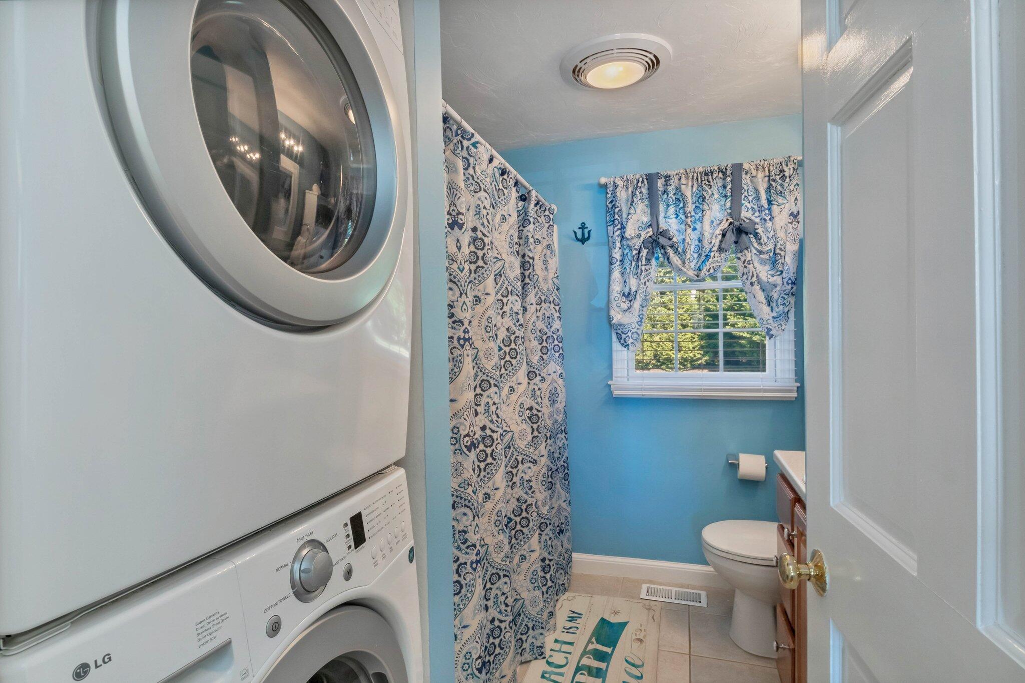 153 Jericho Path, Unit 8U Falmouth, MA 02540 - Photo 19 of 52 a view of a washer and dryer in a bathroom