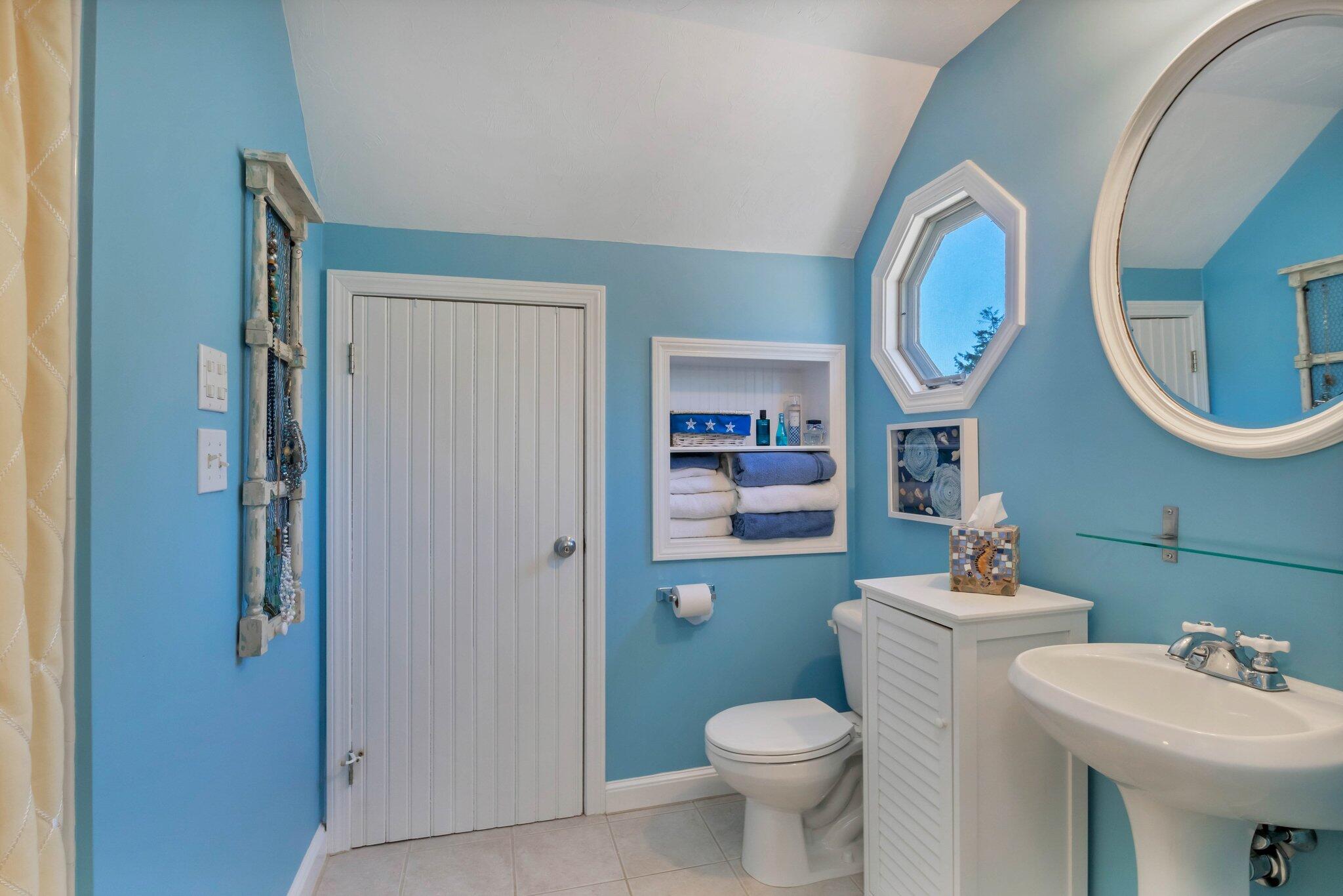 153 Jericho Path, Unit 8U Falmouth, MA 02540 - Photo 23 of 52 a bathroom with a toilet sink and mirror