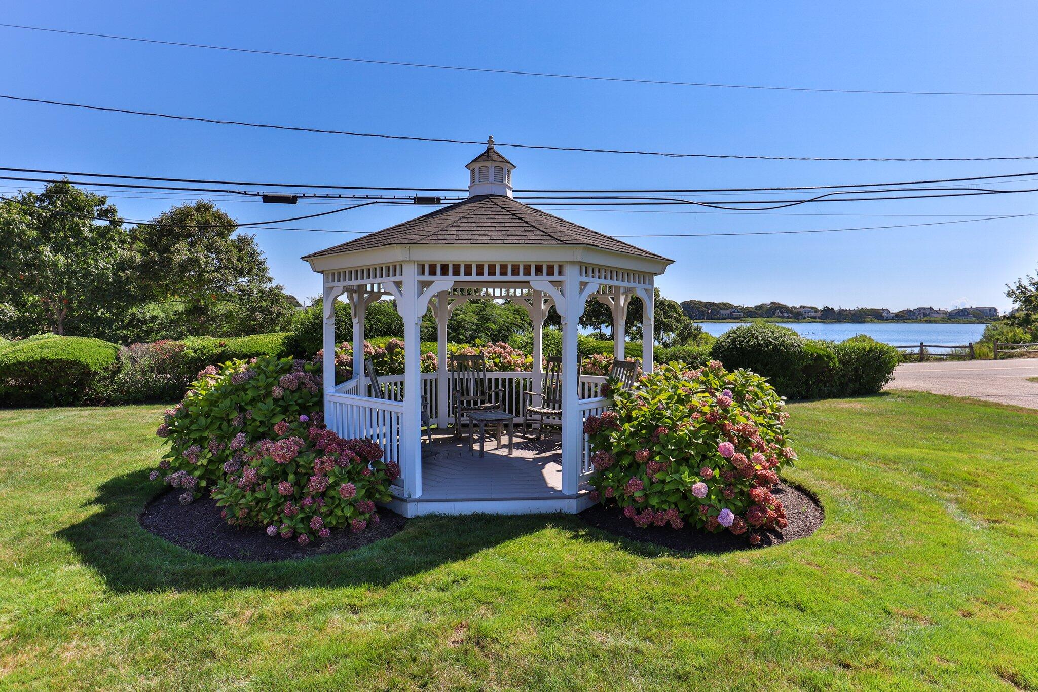 153 Jericho Path, Unit 8U Falmouth, MA 02540 - Photo 31 of 52 a view of a house with a yard potted plants