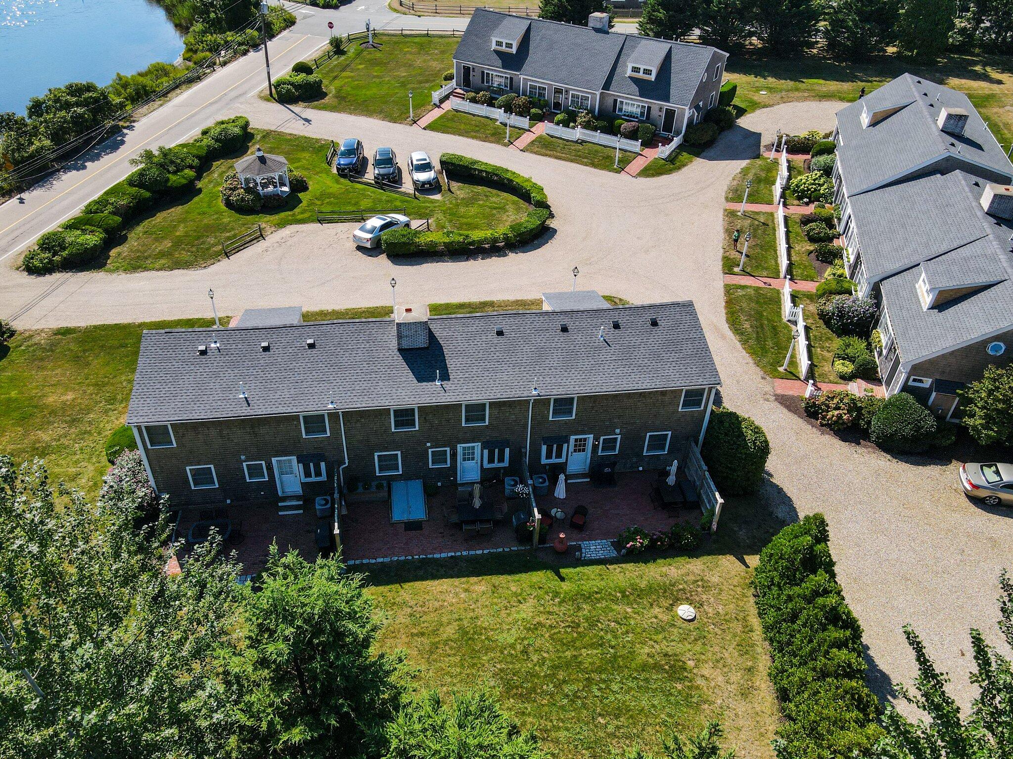 153 Jericho Path, Unit 8U Falmouth, MA 02540 - Photo 34 of 52 an aerial view of a house with garden space and street view