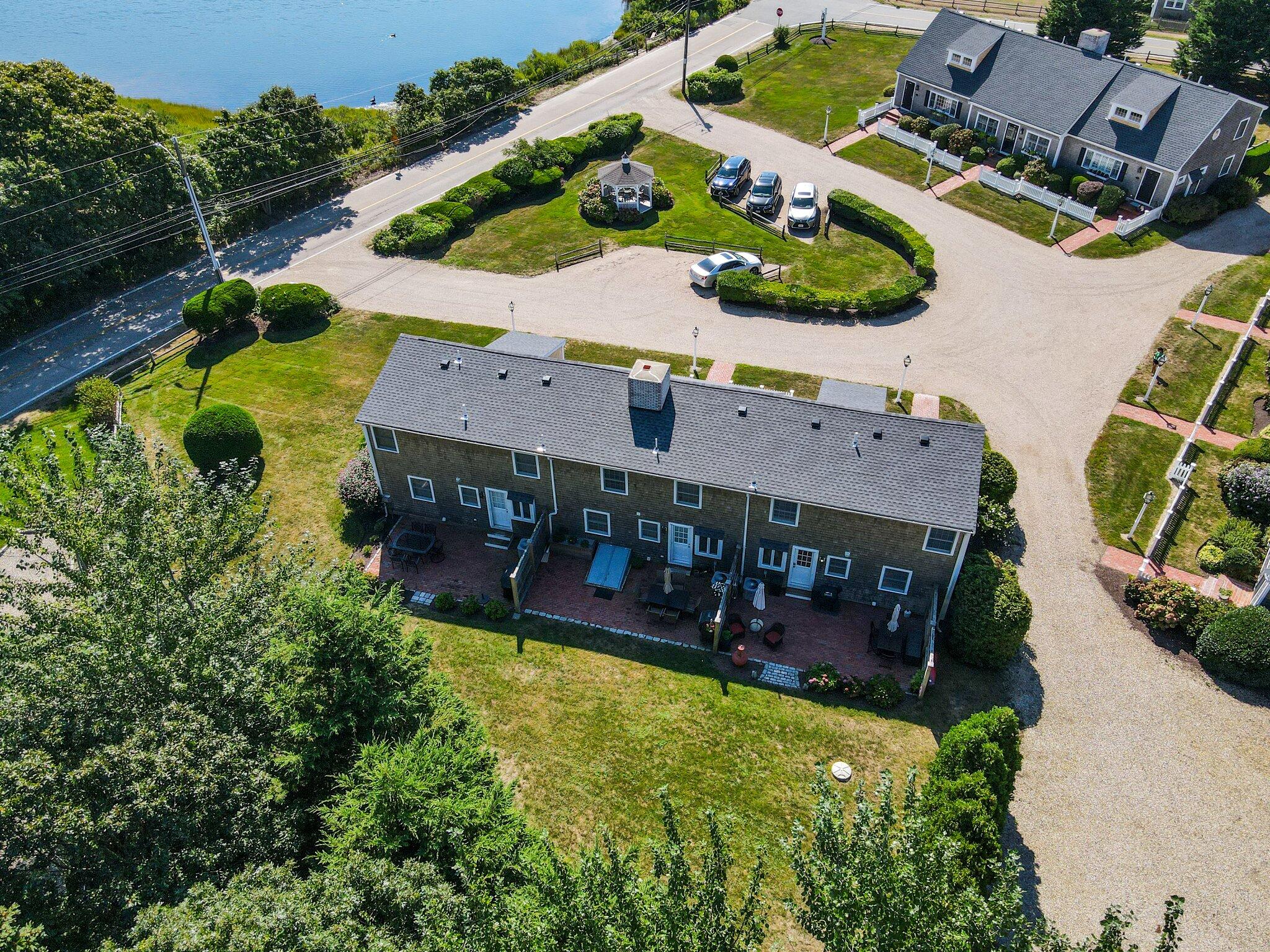 153 Jericho Path, Unit 8U Falmouth, MA 02540 - Photo 35 of 52 an aerial view of a house with yard swimming pool and outdoor seating