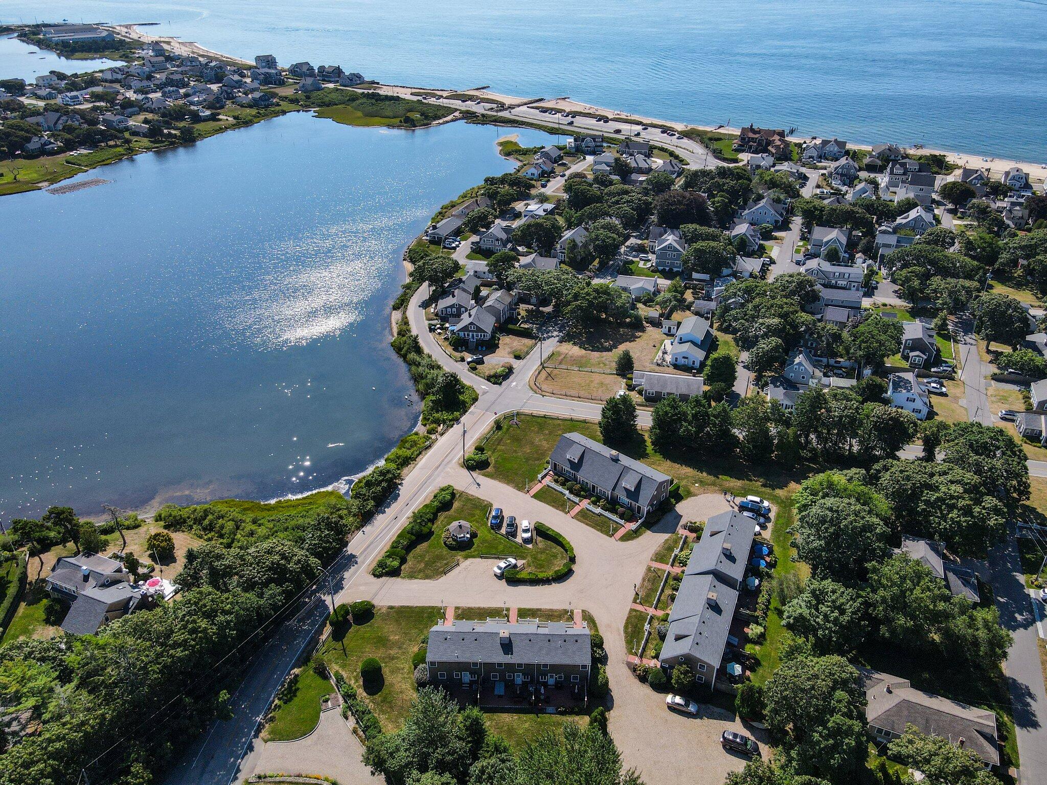 153 Jericho Path, Unit 8U Falmouth, MA 02540 - Photo 39 of 52 an aerial view of house with yard swimming pool and ocean view
