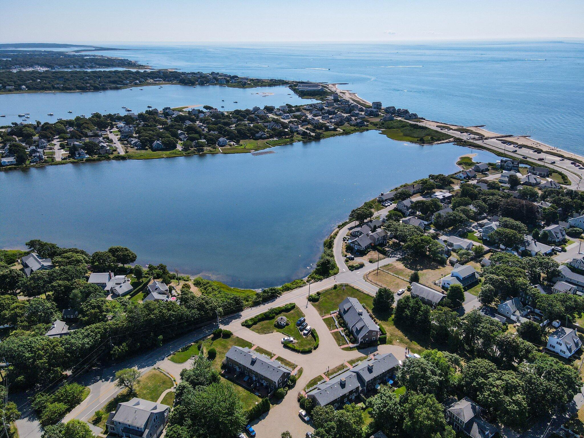 153 Jericho Path, Unit 8U Falmouth, MA 02540 - Photo 40 of 52 an aerial view of a houses with ocean view