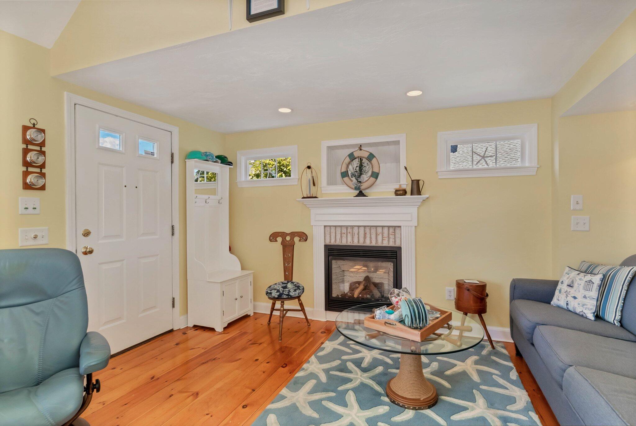153 Jericho Path, Unit 8U Falmouth, MA 02540 - Photo 4 of 52 a living room with furniture and a fireplace