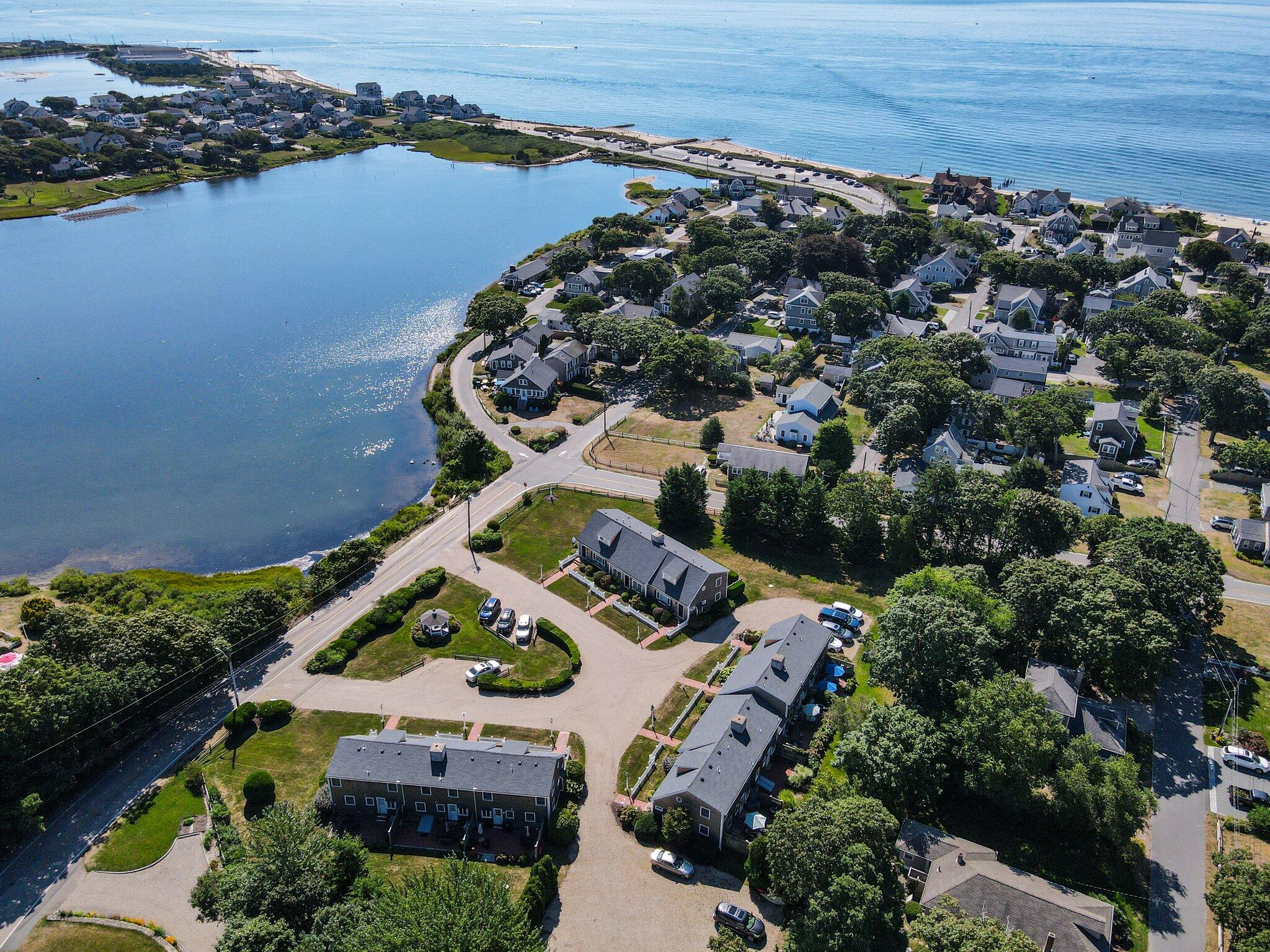 153 Jericho Path, Unit 8U Falmouth, MA 02540 - Photo 45 of 52 an aerial view of house with yard swimming pool and outdoor seating