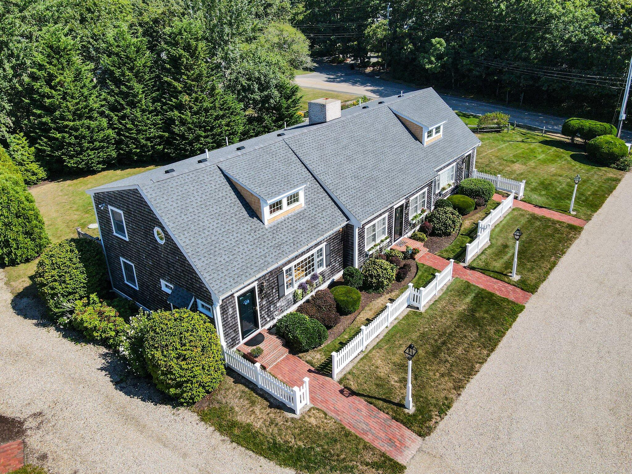 153 Jericho Path, Unit 8U Falmouth, MA 02540 - Photo 47 of 52 an aerial view of a house with a garden