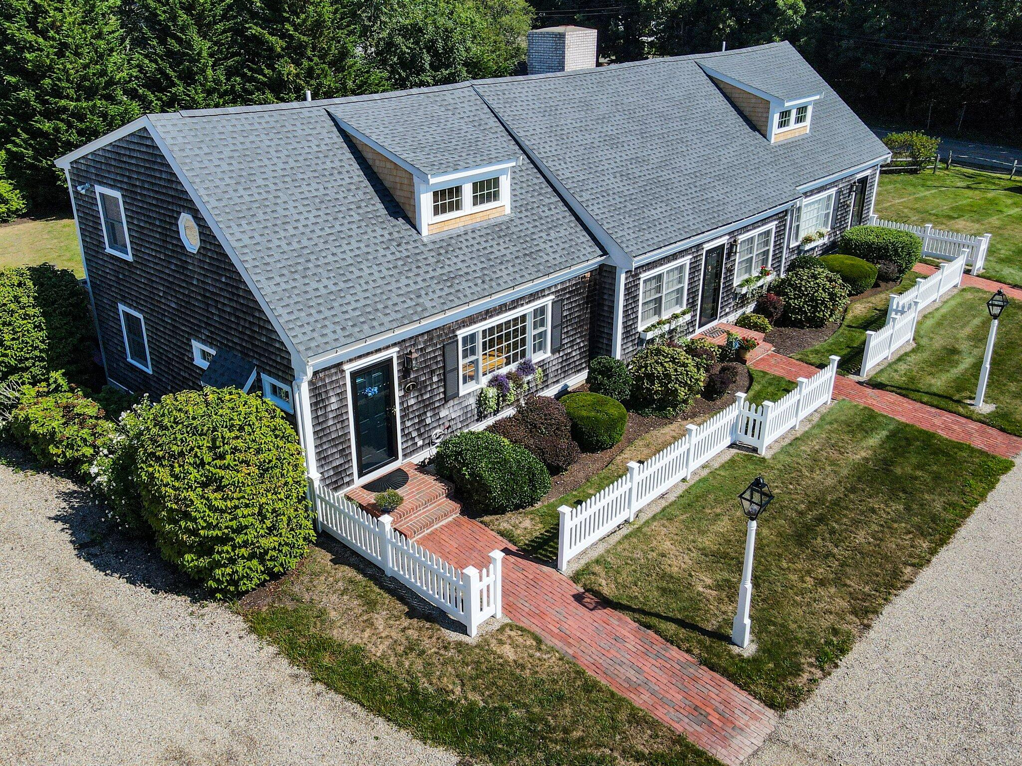 153 Jericho Path, Unit 8U Falmouth, MA 02540 - Photo 49 of 52 front view of a house with a yard