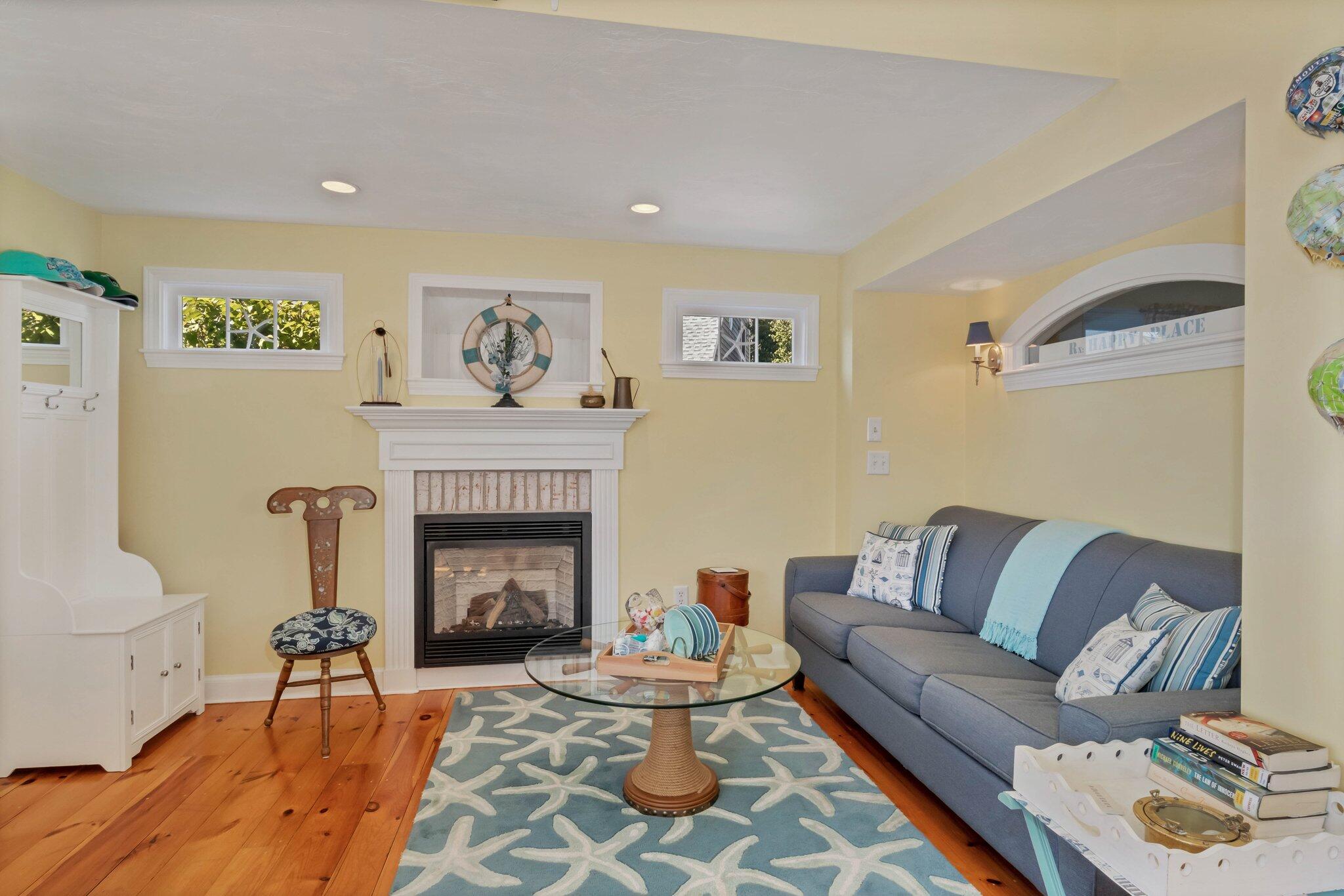 153 Jericho Path, Unit 8U Falmouth, MA 02540 - Photo 5 of 52 a living room with furniture and a fireplace
