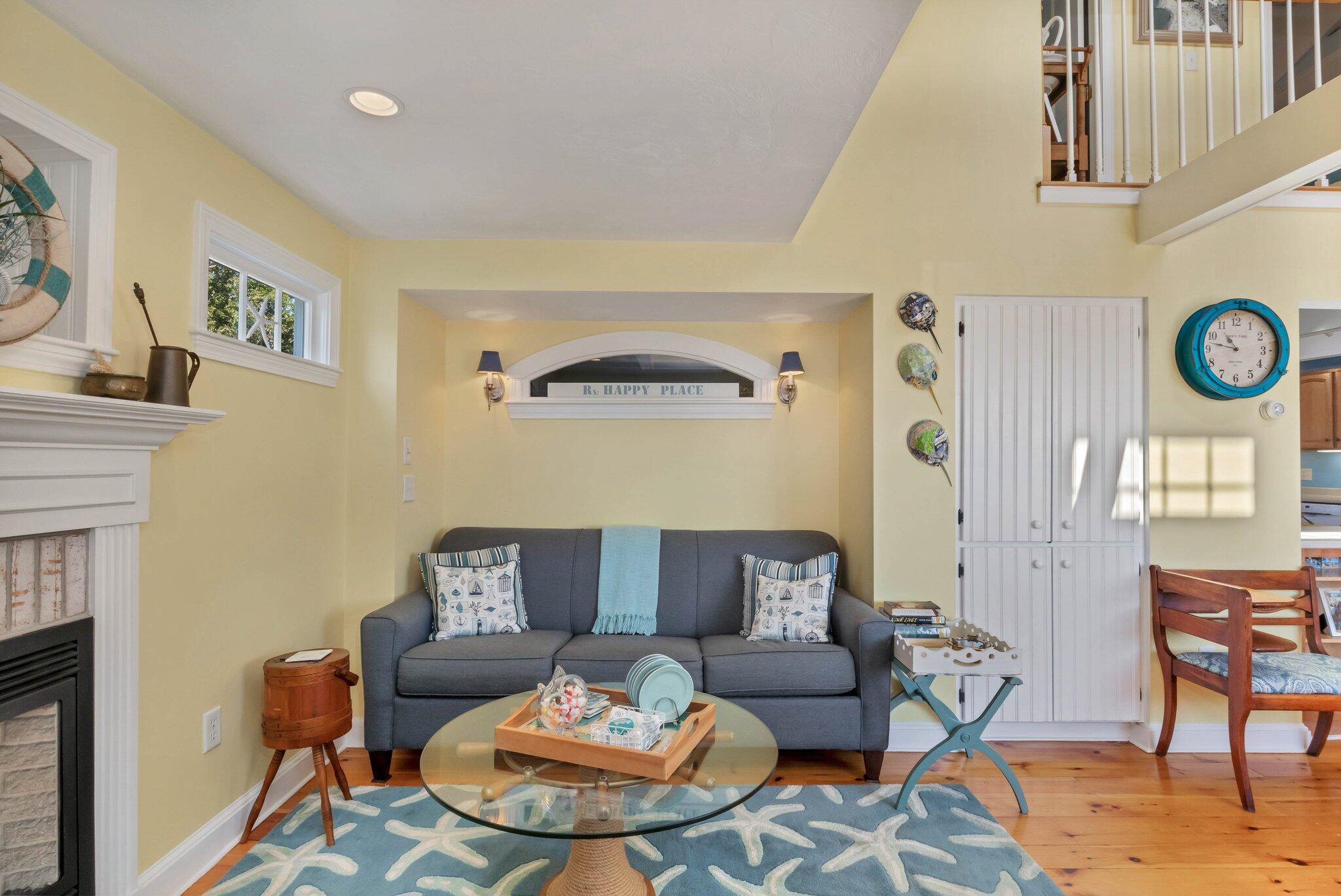 153 Jericho Path, Unit 8U Falmouth, MA 02540 - Photo 6 of 52 a living room with furniture and a fireplace