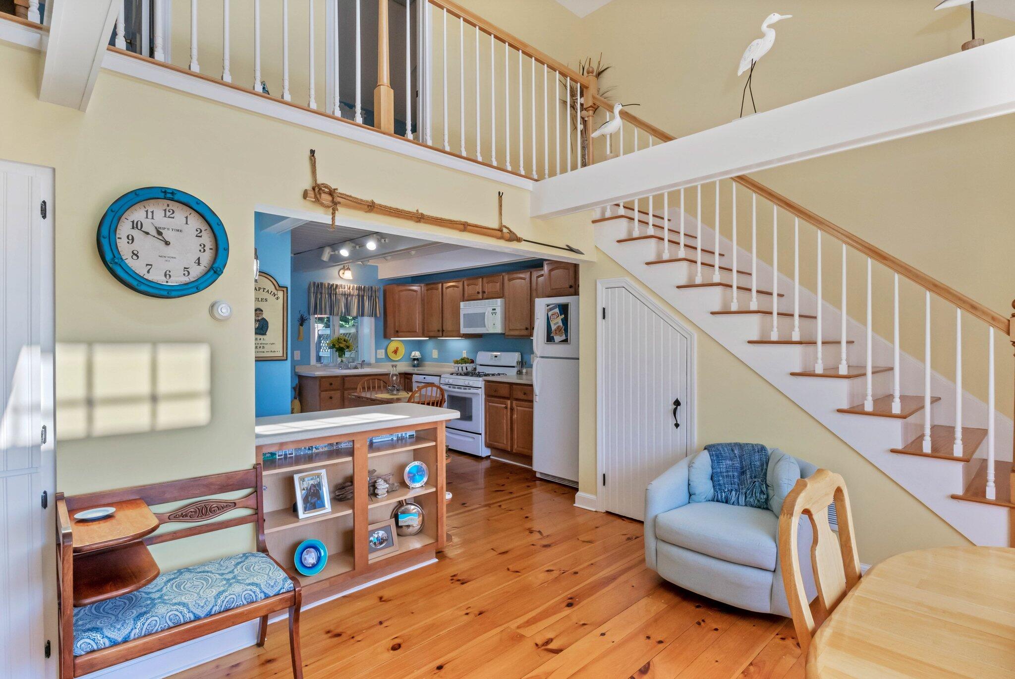 153 Jericho Path, Unit 8U Falmouth, MA 02540 - Photo 9 of 52 a living room with furniture and a table